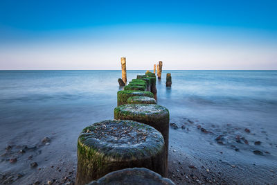 Scenic view of sea against clear blue sky