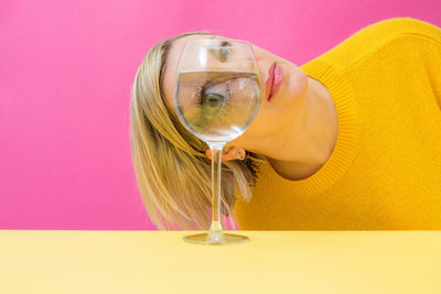 Close-up of woman holding wine glass