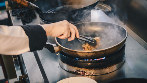 Midsection of man preparing food