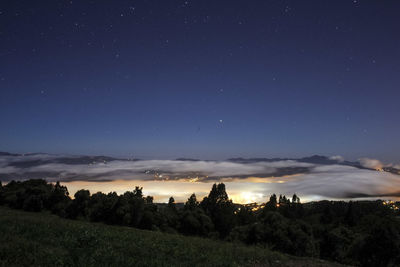 Scenic view of silhouette landscape against sky at night