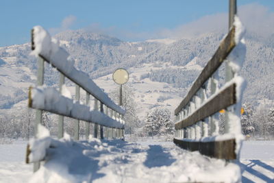 Low angle view of snow covered mountain against sky