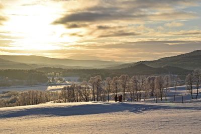 Scenic view of mountains against sky during winter