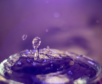Close-up of water splashing in glass