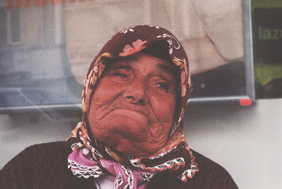 Close-up portrait of a serious young woman