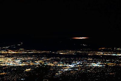 Illuminated cityscape at night