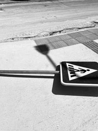 High angle view of road sign on street