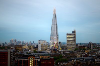 Modern buildings in city against sky