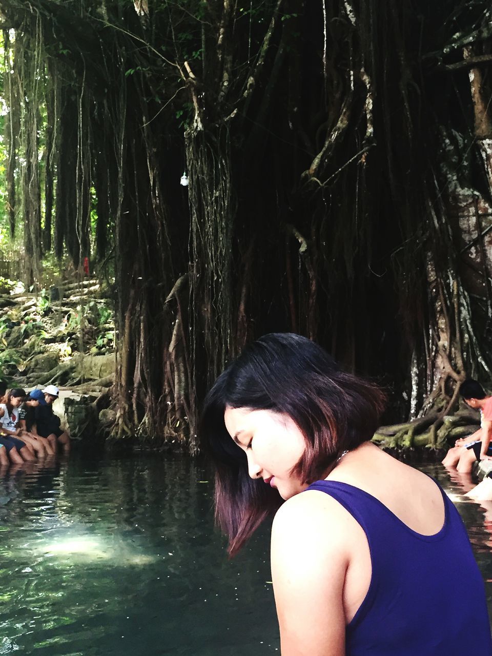 WOMAN SWIMMING IN FOREST