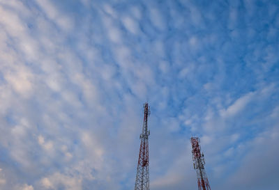 Low angle view of communications tower against sky