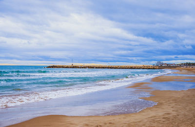 Scenic view of beach against sky