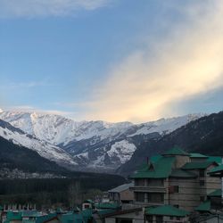 Scenic view of snowcapped mountains against sky