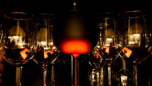 Close-up of wine bottles against black background