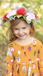 Porter of beautiful little girl wearing a flowers crown