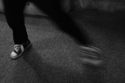 Low section of woman standing on tiled floor