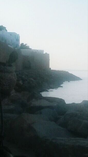 VIEW OF SEA AGAINST CLEAR SKY IN FOGGY WEATHER