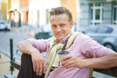 Portrait of young man standing outdoors