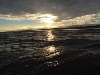 Scenic view of sea against cloudy sky