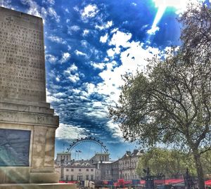 View of town square against cloudy sky