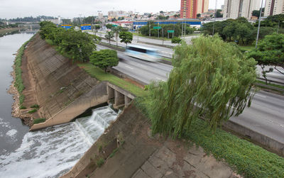 High angle view of road by buildings in city