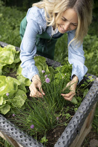 High angle view of woman having food outdoors