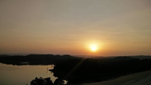 Scenic view of silhouette landscape against sky during sunset