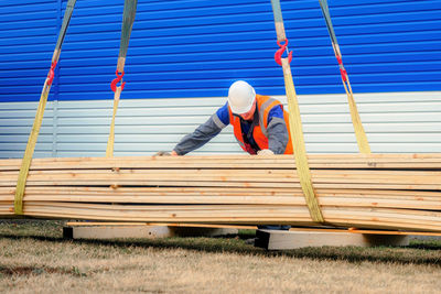 Rear view of man standing on field