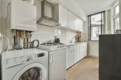 High angle view of woman standing in kitchen