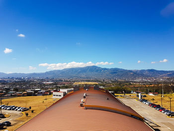 View of mountain range against blue sky