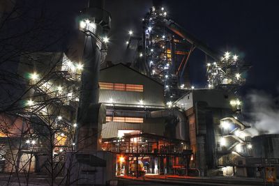 Low angle view of illuminated christmas tree at night