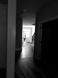 Man standing at entrance of building