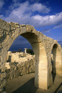 View of old ruin building against cloudy sky