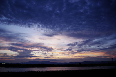 Scenic view of sunset over lake