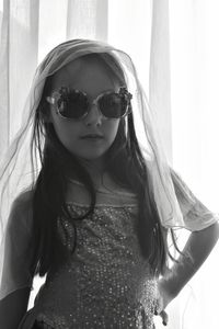 Portrait of young woman wearing sunglasses