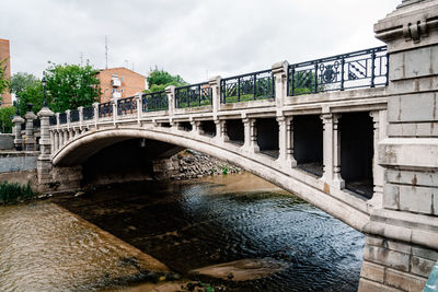 Arch bridge over river