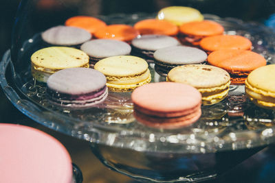 Close-up of fresh macaroons on glass plate