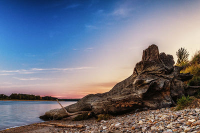 Scenic view of sea against sky at sunset