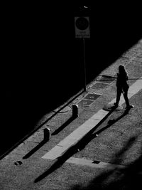 High angle view of woman walking on street