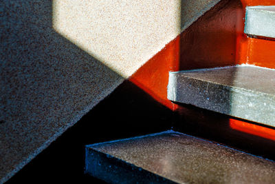 High angle view of multi colored shadow on floor composition stairs 