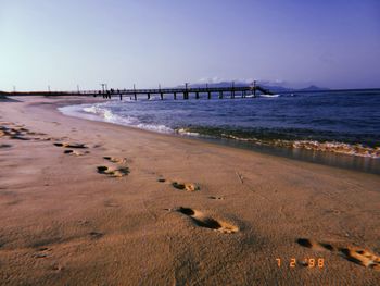 Scenic view of beach against clear sky