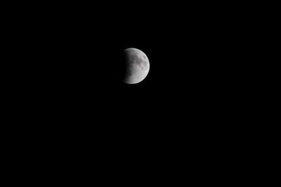 Low angle view of moon against sky at night