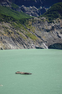 Scenic view of sea against mountain