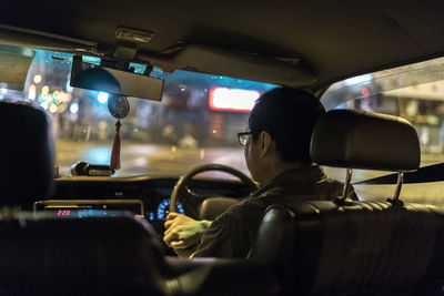Cars on road seen through car window