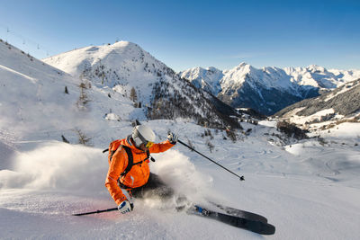 Free-rider skier in action in ski resort on the italian alps