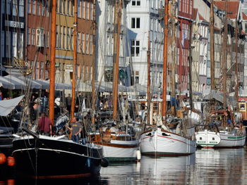 Boats moored at harbor