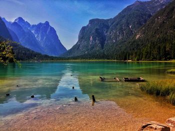 Scenic view of lake and mountains against sky