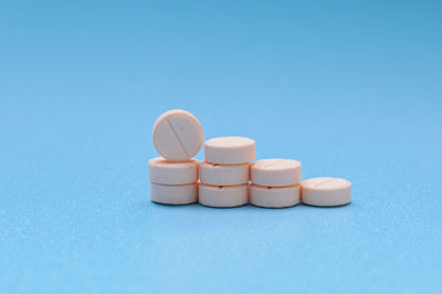 Close-up of pills against blue background