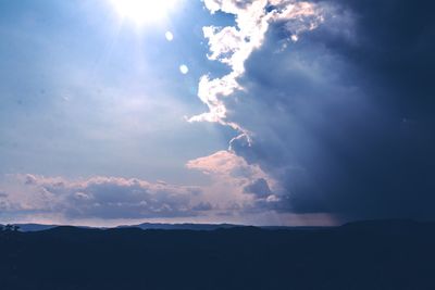 Sun shining through clouds