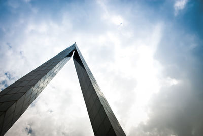 Low angle view of building against cloudy sky