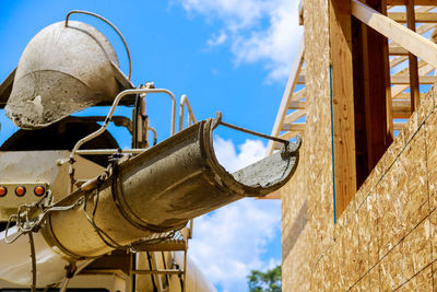 Low angle view of metallic structure against sky