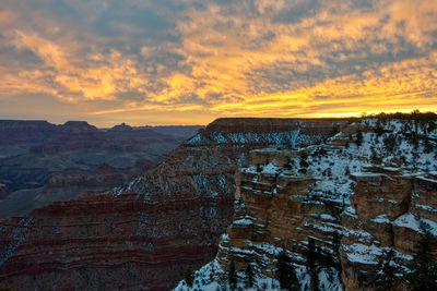 Scenic view of rock formation against sky during sunset